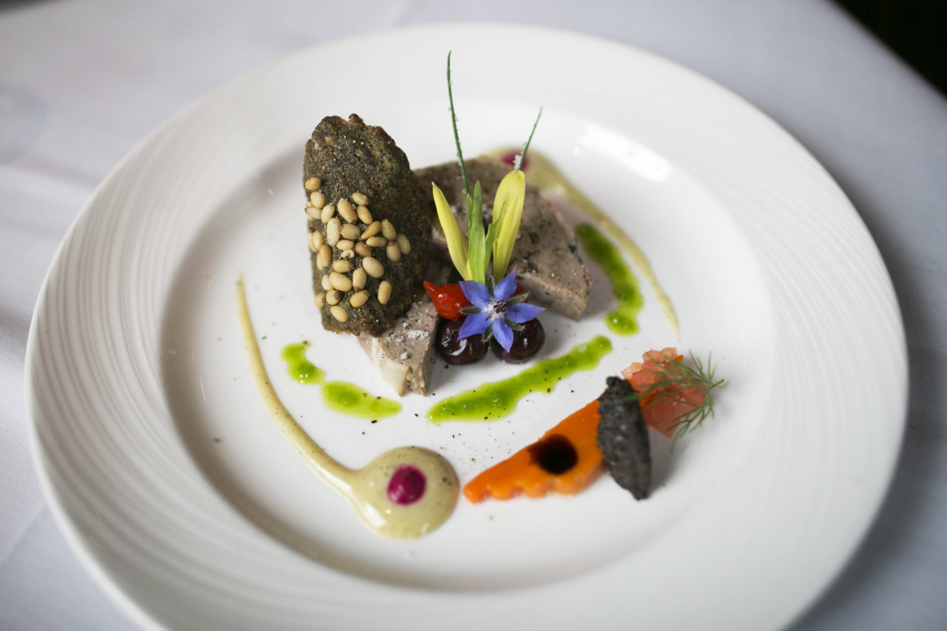 Venison Terrine with Green Lentil, Pine Nut, Tuile, Griotine, Carrot Pirogue, and Provence Artichoke Vinaigrette at the Refectory in Columbus, OH on October 10, 2016.